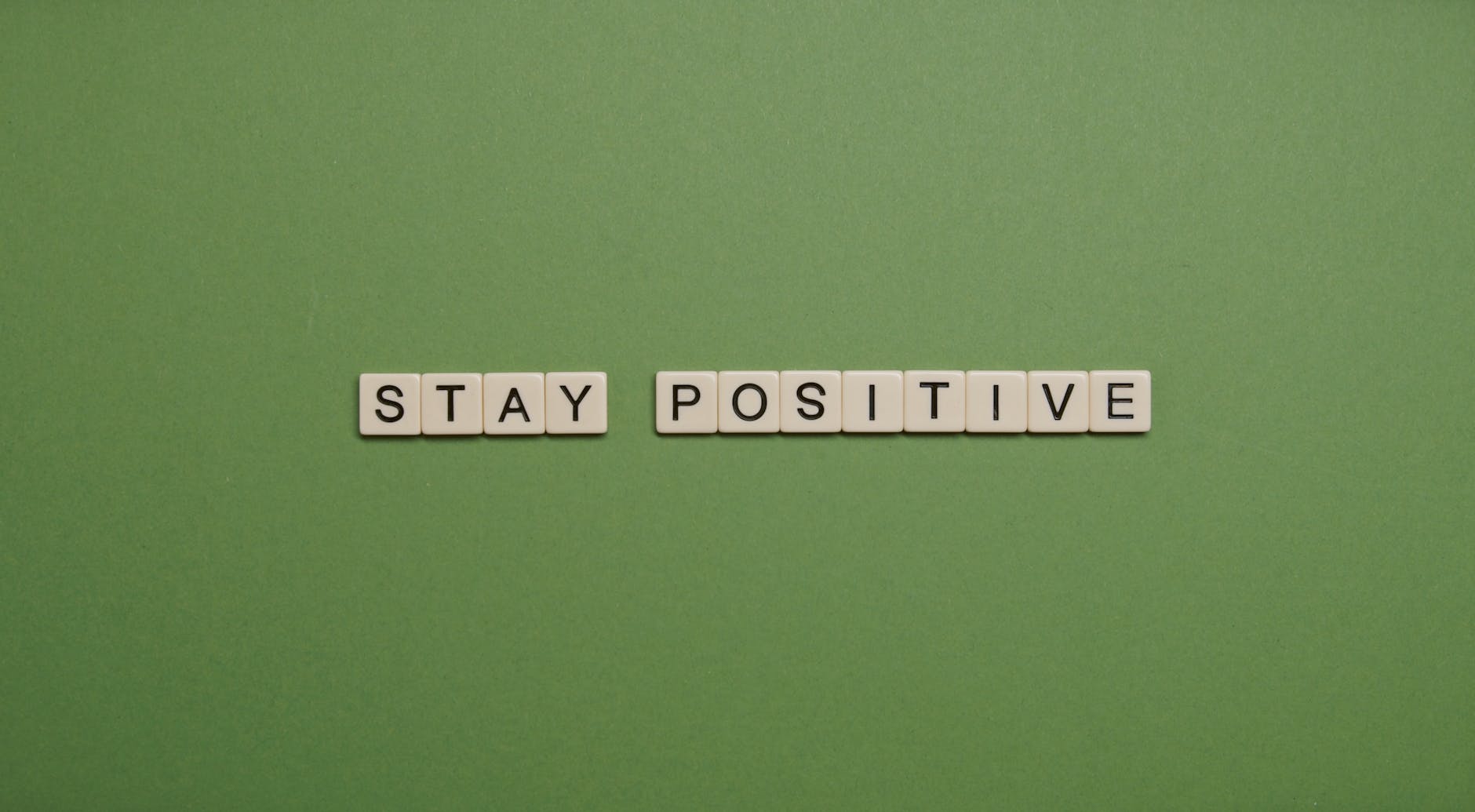 stay positive text on green background